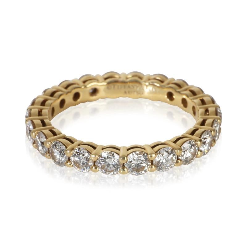 Tiffany & Co. Yellow Gold Diamond Tiffany Forever Eternity Band: Condition: Pre-owned - Good,Shape: Round Brilliant,Side Stone Type: Diamond,Side Stone Weight (cts): 1.80,Metal Purity: 18k,With Original Box/Packaging: No,With Papers: No,Gross Weight (grams): 3.46,D