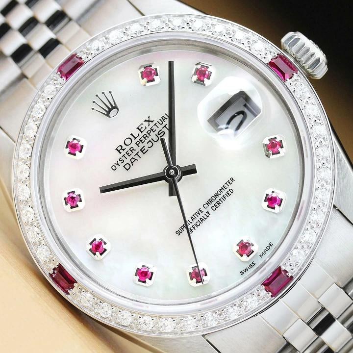 MENS ROLEX DATEJUST 16014 MOTHER OF PEARL RUBY DIAMOND 18K WHITE GOLD SS WATCH: Condition: Pre-owned - Excellent,Bezel Color: Silver,Max Wrist Size: 7.26-7.5 in,Number of Jewels: 27 Jewels,Indices: Ruby Markers, 12-Hour Dial,Bezel: Custom 18K White Gold Ruby Diamond Bezel,Band/St