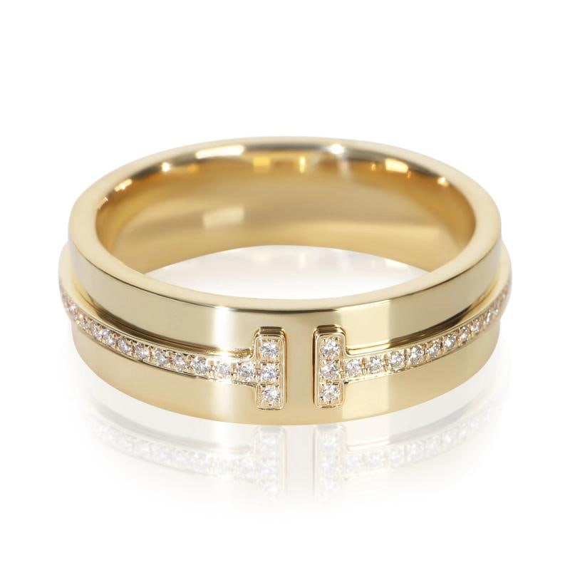 Tiffany & Co. Yellow Gold Diamond Tiffany T Wide Ring: Condition: Pre-owned,Shape: Round Brilliant,With Original Box/Packaging: Yes,Side Stone Type: Diamond,Side Stone Weight (cts): 0.12,Metal Purity: 18k,With Papers: No,Gross Weight (grams):