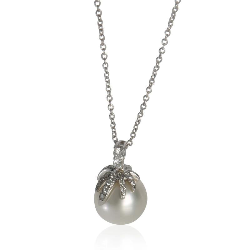 Tiffany & Co. Platinum Pearl and Diamond Fireworks Pendant: Condition: Pre-owned,Pendant Shape: Round Brilliant,Necklace Length: 18 in,Country of Origin: Italy,Clasp/Buckle Type: Spring Ring,Side Stone Type: Diamond,Side Stone Weight (cts): 0.15,Main Stone: Pe