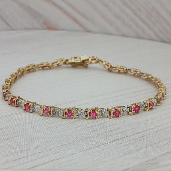 Ruby Link Bracelet In 10k Yellow Gold: Condition: Pre-owned - Good,Antique: No,Closure: Box,Occasion: Anniversary, Birthday, Christmas, Graduation, Mother's Day, Valentine's Day, Wedding,Main Stone Width: 1.8mm,Sizable: No,Main Stone