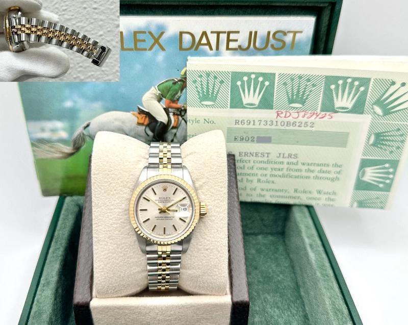 Rolex Datejust Ladies 69173 Silver Dial 18k Gold Stainless Steel Box Paper: Style Number: 69173 Serial: E902*** Year: 1992 Model: Rolex Ladies Datejust Case Material: Stainless Steel Band: 18K Yellow Gold & Stainless Steel Bezel: 18K Yellow Gold Dial: Silver Crystal: Sapphire