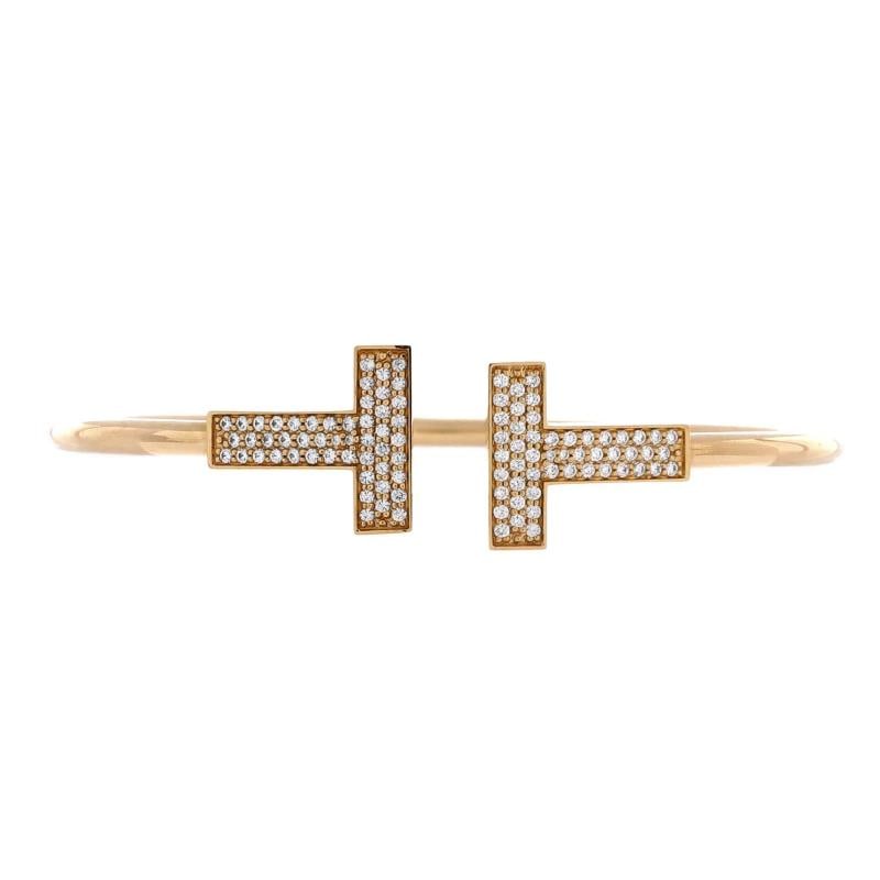 Tiffany & Co. T Wire Bracelet 18K Yellow Gold with Diamonds Wide: Measurements: Circumference: 6.75 ", Width: 2.95 mm . Condition: Pre-owned - Good,Brand: Tiffany & Co.,Main Stone: Diamond,Metal: 18K Yellow Gold,Metal Purity: 18K,Style: Bracelet,Type: