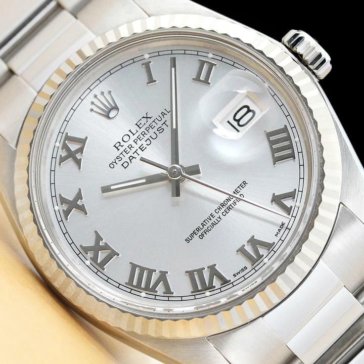 MENS ROLEX DATEJUST 16014 SILVER ROMAN 18K WHITE GOLD STAINLESS STEEL WATCH: Condition: Pre-owned - Excellent,Bezel Color: Silver,Max Wrist Size: 7.26-7.5 in,Number of Jewels: 27 Jewels,Indices: Roman Numerals, 12-Hour Dial,Bezel: Rolex 18K White Gold Fluted Bezel,Band/Strap: