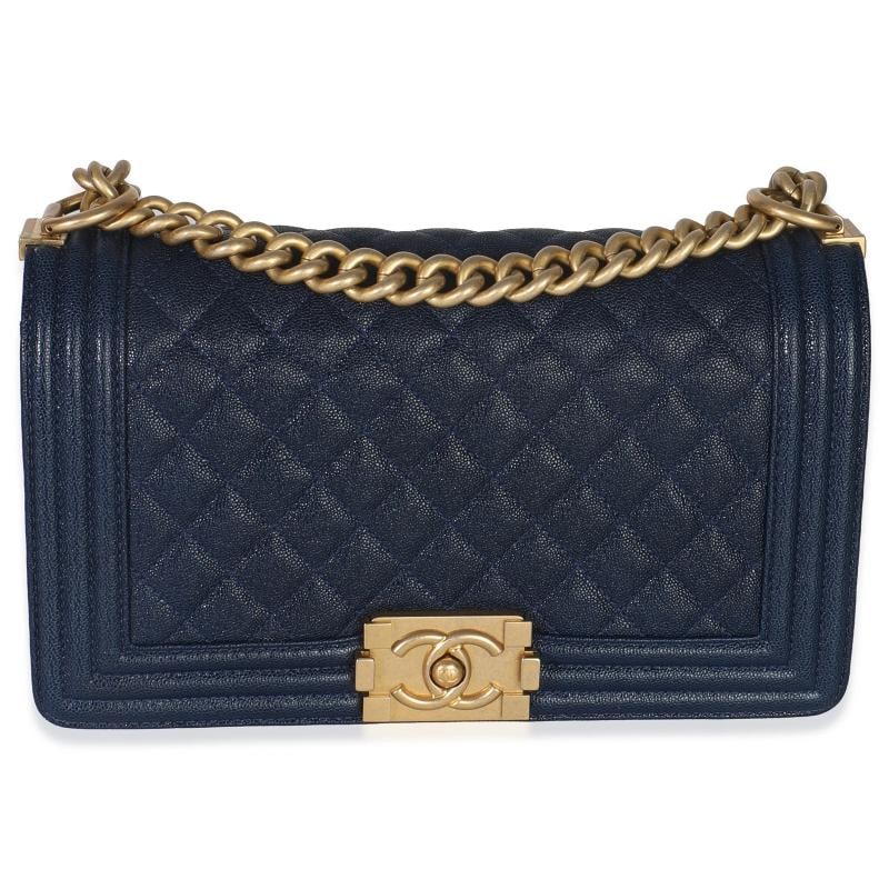 Chanel Navy Quilted Caviar Old Medium Boy Handbag: Condition: Pre-owned - Good,Country of Origin: Italy,Dimensions: 9.75 x 5.5 x 2.75,Handbag Accessories: None,Bag Width: 9.75 in,Bag Depth: 2.75 in,Bag Height: 5.5 in,Department: Unisex,Style: