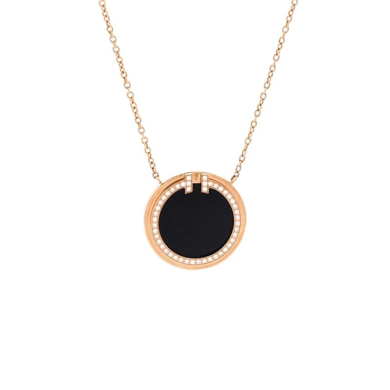 Tiffany & Co. T Circle Pendant Necklace 18K Rose Gold with Onyx and Diamonds: Measurements: Length: 16.0 - 18.0 ", Pendant Length: 16.00 mm, Pendant Width: 16.00 mm . Condition: Pre-owned - Good,Brand: Tiffany & Co.,Main Stone: Onyx,Metal: 18K Rose Gold,Metal Purity: