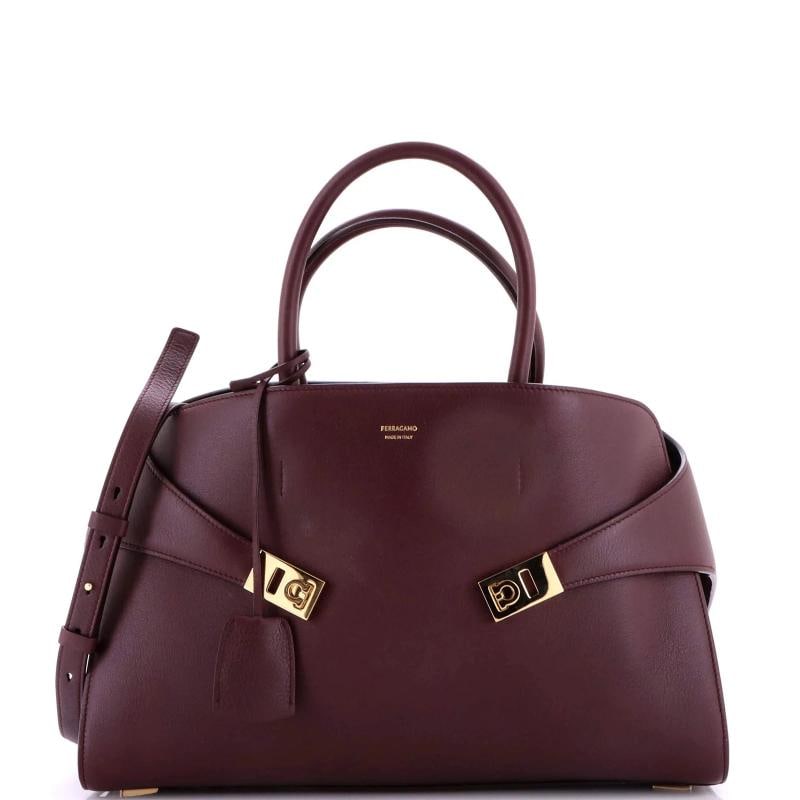 Salvatore Ferragamo Hug Top Handle Bag Leather Large: Accessories: Clochette, Dust Bag, With Strap Measurements: Height 9.5", Width 15", Depth 5". Condition: Pre-owned - Good,Brand: Salvatore Ferragamo,Exterior Material: Leather,Style: Satchels,Exterior