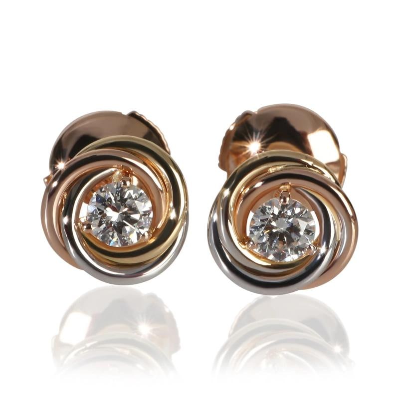 Cartier 3-Tone Gold Diamond Trinity Stud Earrings: Condition: Pre-owned - Good,Shape: Round Brilliant,Item Length: 9 mm,With Original Box/Packaging: Yes,With Papers: Yes,Side Stone Type: Diamond,Side Stone Weight (cts): 0.35,Metal Purity: 18k,Gross