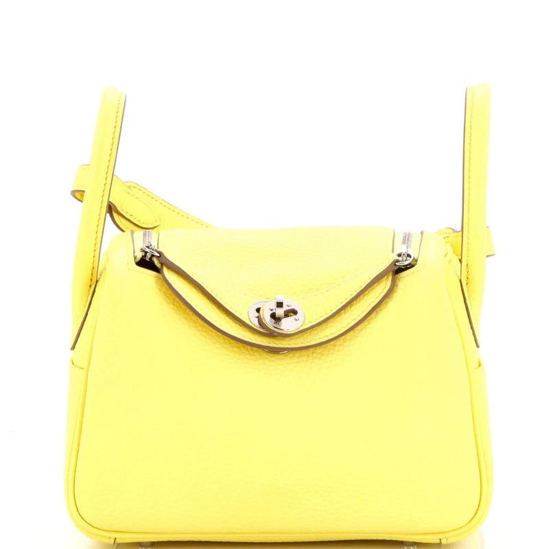 Hermes Lindy Bag Clemence Mini: Condition: Pre-owned - Excellent,Brand: Hermes,Exterior Material: Leather,Style: Cross Body Bags,Exterior Color: Yellow,Department: Women,Size: Mini Condition: Excellent. Exterior: minor scuffs |