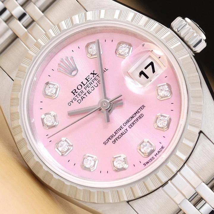 ROLEX LADIES DATEJUST 79240 PINK DIAMOND DIAL STAINLESS STEEL WATCH: This is an authentic Rolex Datejust 79240 watch with Rolex stainless steel jubilee band, Rolex dial Ref. with added genuine diamond hour markers, and Rolex stainless steel engine-turned