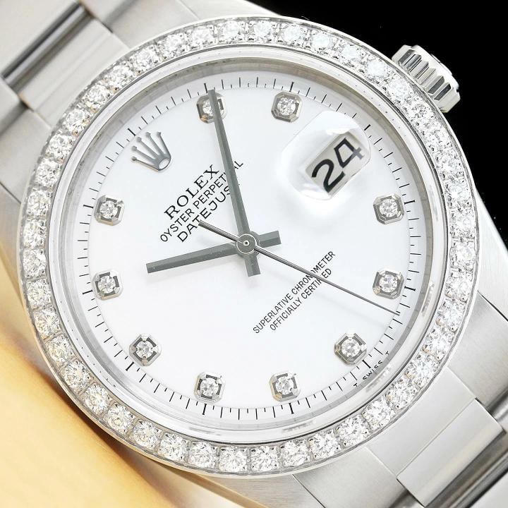 MENS ROLEX DATEJUST 1603 WHITE DIAL 18K WHITE GOLD 1.60 CT DIAMOND STEEL WATCH: This is an authentic Rolex Datejust 1603 watch with Rolex dial Ref. with added custom diamond markers, custom stainless steel oyster bracelet, and custom 18K white gold 1.60 CT diamond