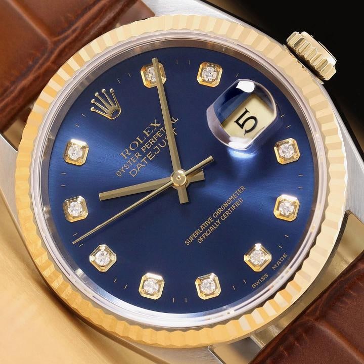 ROLEX DATEJUST 16233 BLUE DIAMOND DIAL 18K GOLD STEEL WATCH w/ LEATHER BAND: This is an authentic Rolex Datejust 16233 watch with Rolex dial Ref. with added diamond markers, Rolex 18K yellow gold fluted bezel, and custom genuine brown leather strap. Descriptions: Brand: Rolex