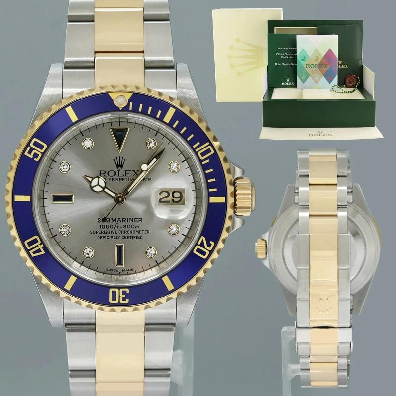 MINT PAPERS Rolex Submariner 16613 Two Tone Gold Silver Serti Diamond Watch Box: Box: Yes, this item includes the Original Rolex Box. Papers: Yes, this watch comes with Original Rolex warranty papers. Case & Dial Case Material: Rolex Two-Tone Yellow Gold & Stainless Steel Case