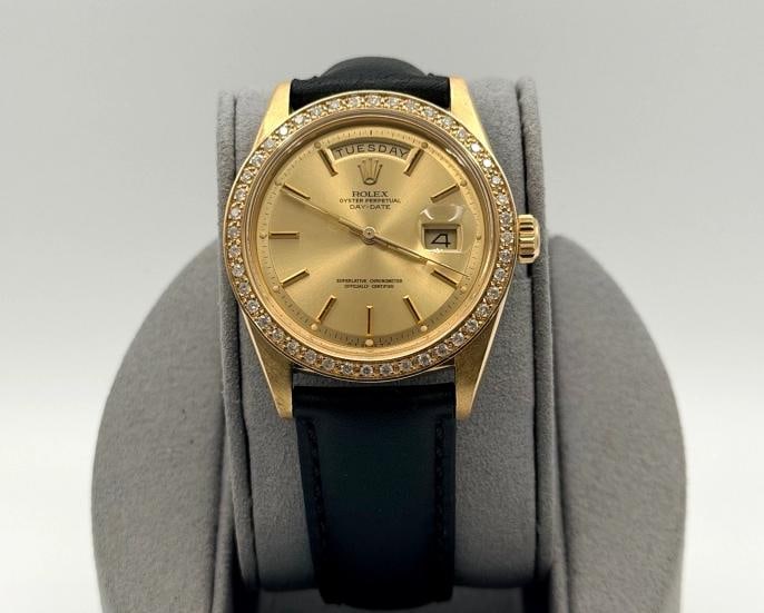 Vintage Rolex Day Date 1803 36mm Champagne Dial Diamond Bezel 18K Yellow Gold: Style Number: 1803 Serial: 1973 Year: 342**** Model: Rolex Day Date Case Material: 18K Yellow Gold Band: Custom Leather Strap Bezel: Custom Diamond Bezel Dial: Champagne Pie Pan Dial Crystal: Acrylic