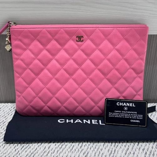 Chanel Lambskin Quilted Medium Casino Beauty CC Cosmetic Pouch in Fuchsia (2016): Condition: Used,Brand: CHANEL,Type: Makeup Bag,Color: Pink,Country of Origin: China This pre-owned Chanel Lambskin Quilted Medium Casino Beauty CC Cosmetic Pouch in Fuchsia is a bold and playful