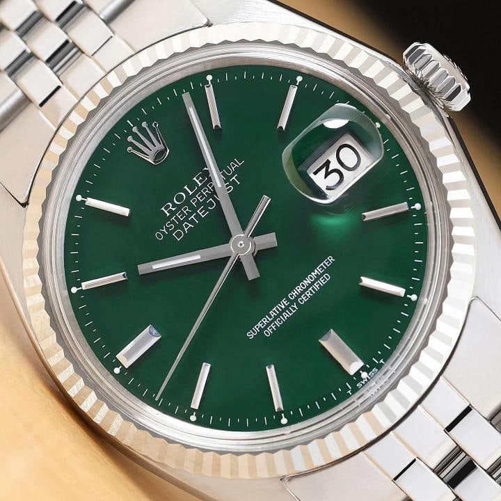 ROLEX DATEJUST 1601 GREEN DIAL 18K WHITE GOLD STEEL FOLDED BRACELET WATCH: This is an authentic Rolex Datejust 1601 watch with Rolex stick dial Ref., Rolex 18K white gold fluted bezel, and Rolex stainless steel folded jubilee bracelet. Descriptions: Brand: RolexModel: