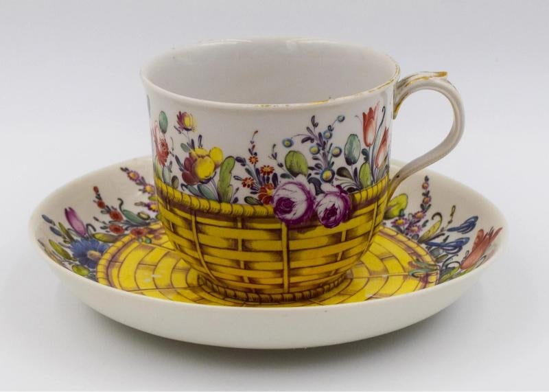 Antique Nymphenburg Cup & Saucer Decorated with Flowers & Basket, Circa 1800: Measurements: Cup 2 3/8" high by 3 1/2" rim to handle wide. Saucer 5 1/4" diameter by 7/8" deep.