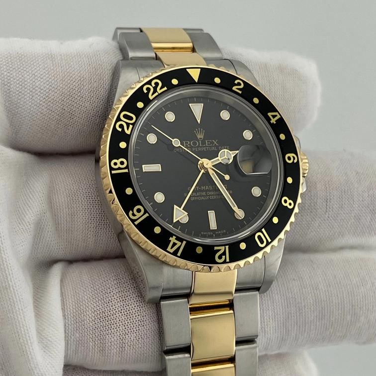 2005 Rolex GMT Master II 16713 40mm Black Dial 18k Yellow Gold Steel Box Papers - 2