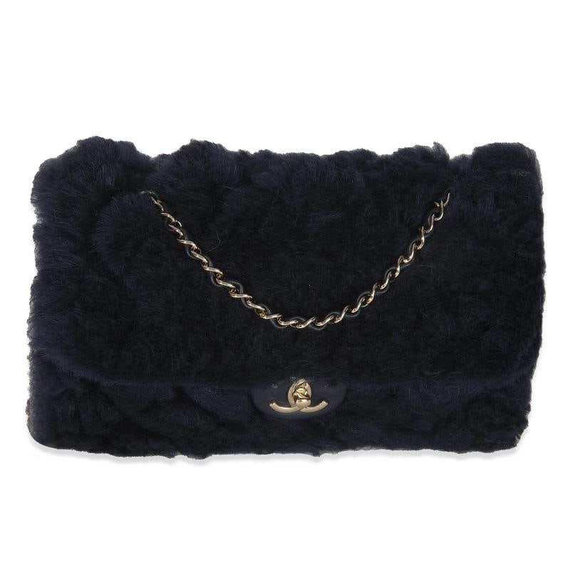 Chanel Navy Shearling Quilted Lambskin Medium Flap Bag: Condition: Pre-owned - Good,Country of Origin: France,Dimensions: 10.5 x 6.5 x 2.25,Handbag Accessories: Care Booklet;Authenticity Card,Bag Width: 10.5 in,Bag Depth: 2.25 in,Bag Height: 6.5