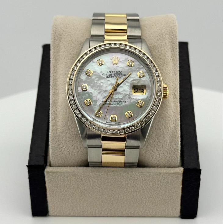 Rolex Datejust 16013 36mm MOP Diamond Dial Diamond Bezel 18K Yellow Gold Steel: Style Number: 16013 Serial: 590**** Year: 1979 Model: Rolex Datejust Case Material: Stainless Steel Band: 18K Yellow Gold & Stainless Steel Bezel: Custom Diamond Bezel Dial: Custom White Mother of