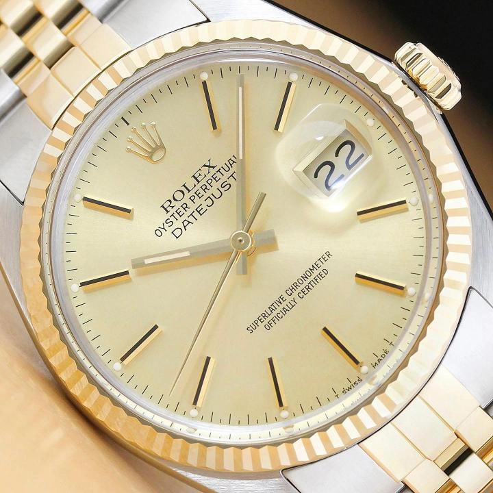 ROLEX MENS DATEJUST 16013 18K YELLOW GOLD STEEL CHAMPAGNE DIAL TWO TONE WATCH: This is an authentic Rolex Datejust 16013 watch with original Rolex two tone 18K yellow gold and stainless steel jubilee bracelet, Rolex stick dial, and Rolex 18K yellow gold fluted bezel.