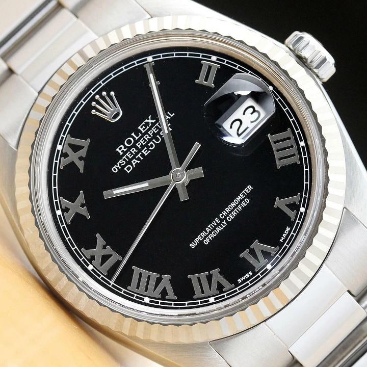 MENS ROLEX DATEJUST 16014 BLACK ROMAN 18K WHITE GOLD FLUTED BEZEL STEEL WATCH: Condition: Pre-owned - Excellent,Bezel Color: Silver,Max Wrist Size: 7.26-7.5 in,Number of Jewels: 27 Jewels,Indices: Roman Numerals, 12-Hour Dial,Bezel: Rolex 18K White Gold Fluted Bezel,Band/Strap: