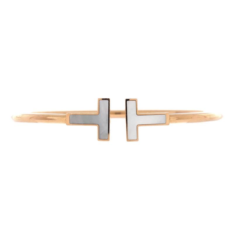 Tiffany & Co. T Wire Bracelet 18K Rose Gold with Mother of Pearl: Condition: Pre-owned - Good,Brand: Tiffany & Co.,Main Stone: Unknown,Metal: 18K Rose Gold,Metal Purity: 18K,Style: Bracelet,Type: Bracelet,Color: Rose Gold,Material: 18K Rose Gold, Mother Of Pearl