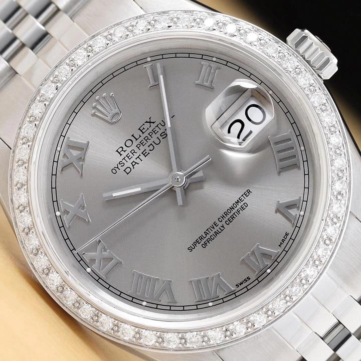 ROLEX MENS DATEJUST 16014 GRAY ROMAN DIAMOND 18K WHITE GOLD STEEL JUBILEE WATCH: This is an authentic Rolex Datejust 16014 watch with Rolex dial Ref. with added roman markers, custom 18K white gold diamond bezel, and custom stainless steel jubilee band. Descriptions: Brand: Rolex 