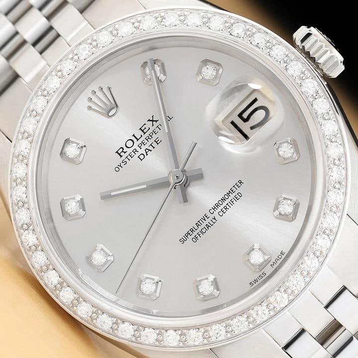 ROLEX OYSTER PERPETUAL DATE 1500 34MM STAINLESS STEEL SILVER DIAMOND WATCH: This is an authentic Rolex Oyster Perpetual Date 34 mm watch with Rolex dial Ref. with added diamond markers, custom 18K white gold diamond bezel, and custom stainless steel jubilee bracelet. Descript