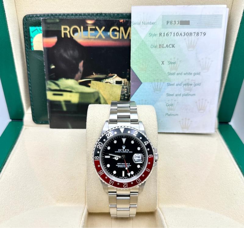 Rolex GMT Master II 16710 COKE Red and Black Bezel Stainless Steel Box Papers: Style Number: 16710 Serial: P833*** Year: 2000 Model: Rolex GMT Master II "COKE" Case Material: Stainless Steel Band: Stainless Steel Bezel: Red & Black Dial: Black Crystal: Sapphire Case Size: 40mm I