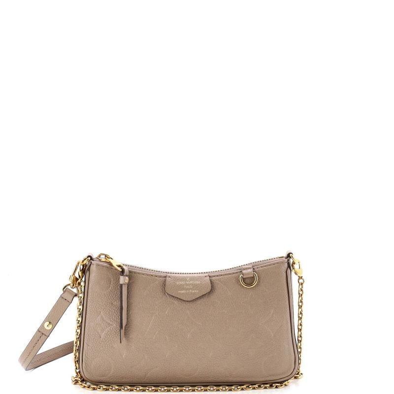 Louis Vuitton Easy Pouch on Strap Monogram Empreinte Leather: Condition: Pre-owned - Good,Brand: Louis Vuitton,Exterior Material: Leather,Style: Shoulder Bags,Exterior Color: Neutral,Department: Women,Size: Unknown,Accessories: Extra Strap, With Strap