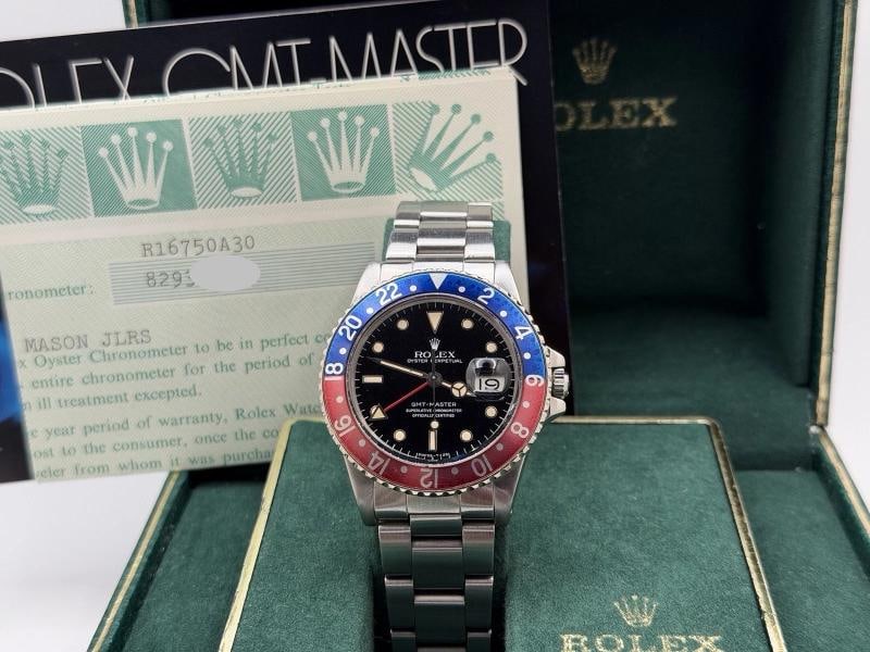 Rolex GMT Master Pepsi 16750 40mm Patina Dial Red Blue Bezel Steel Box Paper: Style Number: 16750 Serial: 829**** Year: 1984 Model: Rolex GMT Master Case Material: Stainless Steel. We did not have this piece polished. Band: Stainless Steel Bezel: Pepsi - Blue and Red. some spot