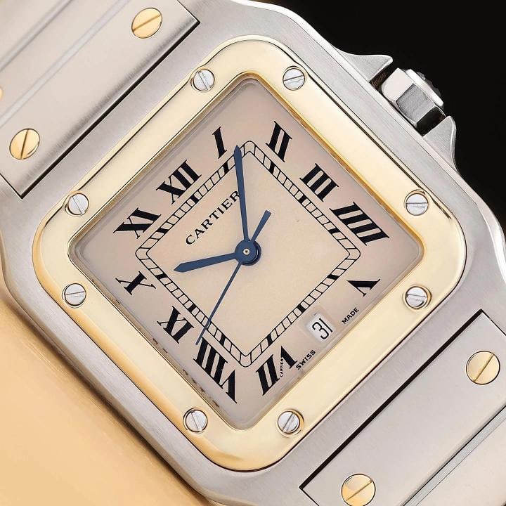 CARTIER SANTOS GALBEE W20011C4 29MM IVORY ROMAN DIAL 18K GOLD STEEL WATCH: This is an authentic Cartier Santos Galbee W20011C4 watch with ivory dial with roman numeral hour markersÃ¢â‚¬â€¹, stainless steel and 18K yellow gold fixed