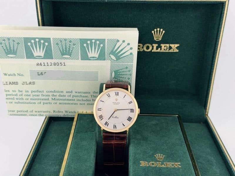 Rolex Cellini 4112 32mm Silver Roman Dial 18k Yellow Gold Box Paper: Style Number: 4112 Serial: L60**** Year: 1989 Model: Rolex Cellini Case Material: 18k Yellow Gold Band: Brown Leather Bezel: 18k Yellow Gold Dial: Silver Roman Dial Case Size: 32mm Includes: - Rolex