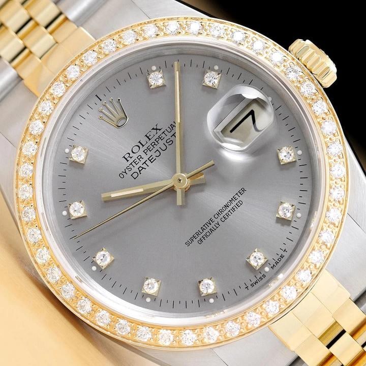 ROLEX DATEJUST 16233 GRAY FACTORY DIAMOND 18K YELLOW GOLD STEEL TWO TONE WATCH: This is an authentic Rolex Datejust 16233 watch with a two tone 18K yellow gold and stainless steel jubilee bracelet, factory Rolex diamond dial Ref., and custom 18K yellow gold diamond bezel. Descrip