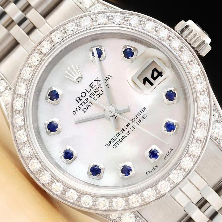 ROLEX DATEJUST 69174 MOTHER OF PEARL SAPPHIRE DIAMOND 18K WHITE GOLD STEEL WATCH: This is an authentic Rolex Datejust 69174 watch with Rolex stainless steel jubilee bracelet, Rolex dial Ref. with added mother of pearl and sapphire markers, custom 18K white gold diamond bezel, and