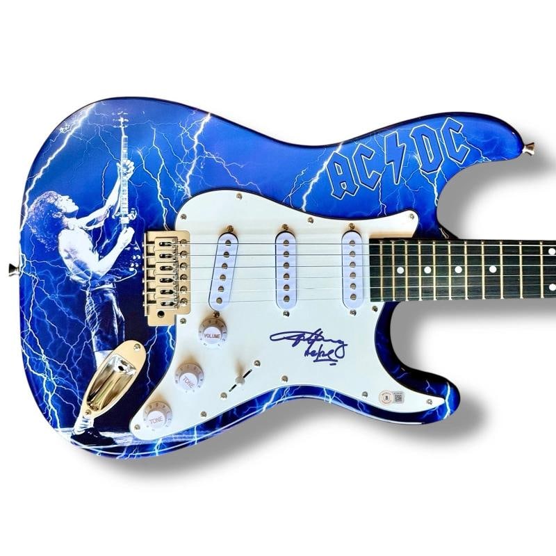Angus Young Signed Guitar Custom Graphics Beckett COA AC/DC Thunderstruck TNT: Industry: Music,Signed: Yes,Autograph Authentication: Beckett,Object Type: Guitar & Guitar Pick,Original/Reproduction: Original,Country of Origin: United States Signer: Angus Young with "AC/DC" inscri