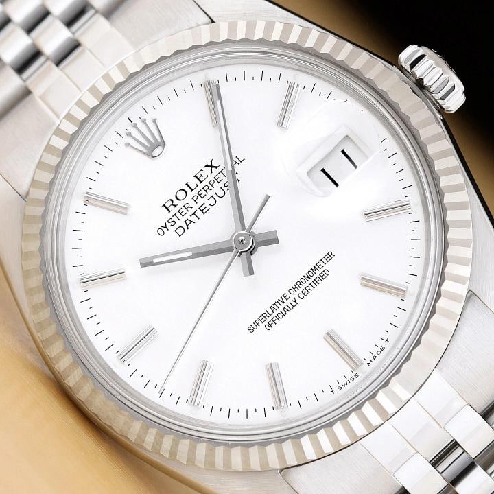 ROLEX MENS DATEJUST 16014 WHITE DIAL 18K WHITE GOLD STAINLESS STEEL WATCH: Condition: Pre-owned - Excellent,Bezel Color: Silver,Max Wrist Size: 7.26-7.5 in,Number of Jewels: 27 Jewels,Indices: Stick Indexes, 12-Hour Dial,Bezel: Rolex 18K White Gold Fluted Bezel,Band/Strap: B