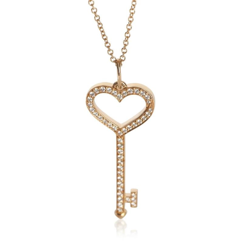 Tiffany & Co. Rose Gold Diamond Heart Key Pendant: Condition: Pre-owned,Clasp/Buckle Type: Spring Ring,With Original Box/Packaging: Yes,Side Stone Type: Diamond,Side Stone Weight (cts): 0.17,Metal Purity: 18k,With Papers: No,Gross Weight (grams):