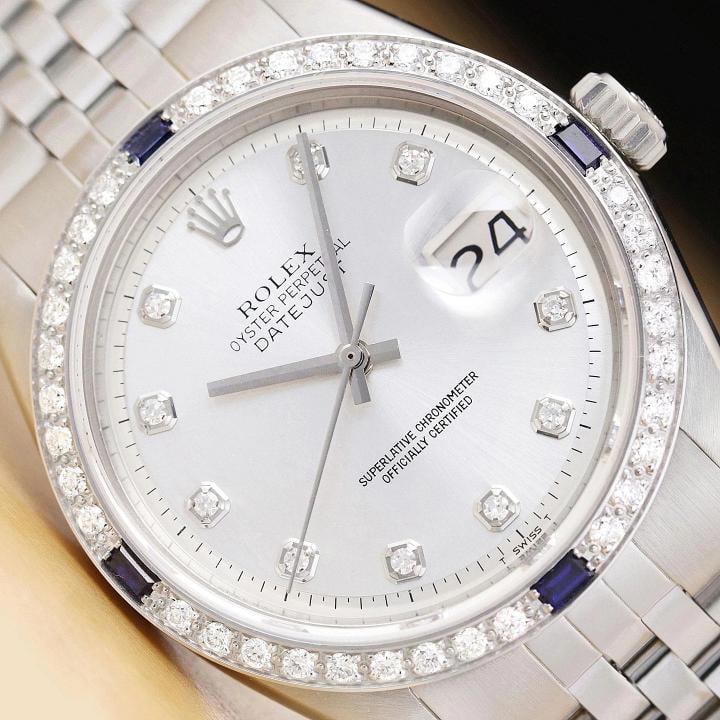 ROLEX MENS DATEJUST SILVER 18K GOLD STEEL DIAMOND SAPPHIRE WATCH w/ FOLDED BAND: This is an authentic Rolex Datejust 1603 watch with custom 18K white gold diamond and sapphire bezel, Rolex dial Ref. with added genuine diamond markers, and Rolex stainless steel folded jubilee brace
