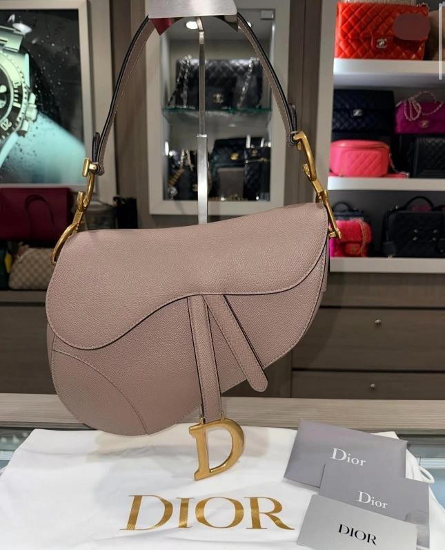 Christian Dior Taupe Saddle Bag (2023): Condition: Pre-owned - Excellent,Brand: Dior,Accessories: Original Dust Bag,Department: Women,Closure: Magnetic,Handle Style: Shoulder Strap,Exterior Color: Taupe,Hardware Color: Gold,Style: Saddle