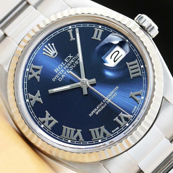 MENS ROLEX DATEJUST 16014 BLUE ROMAN DIAL 18K WHITE GOLD SS WATCH w/ OYSTER BAND: Condition: Pre-owned - Excellent,Bezel Color: Silver,Max Wrist Size: 7.26-7.5 in,Number of Jewels: 27 Jewels,Indices: Roman Numerals, 12-Hour Dial,Bezel: Rolex 18K White Gold Fluted Bezel,Band/Strap: