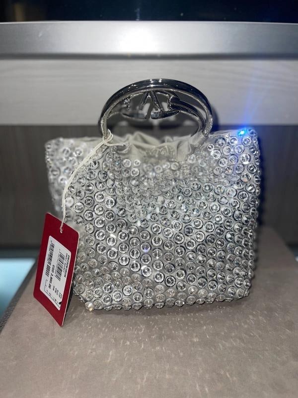 Valentino Garavani Carry Secrets mini bag: Condition: Pre-owned - Good,Brand: Valentino,Department: Women,Size: Mini,Exterior Color: Silver,Style: Top Handle Bag,Exterior Material: Sequin detailing with prominent VLogo Signature in metallic