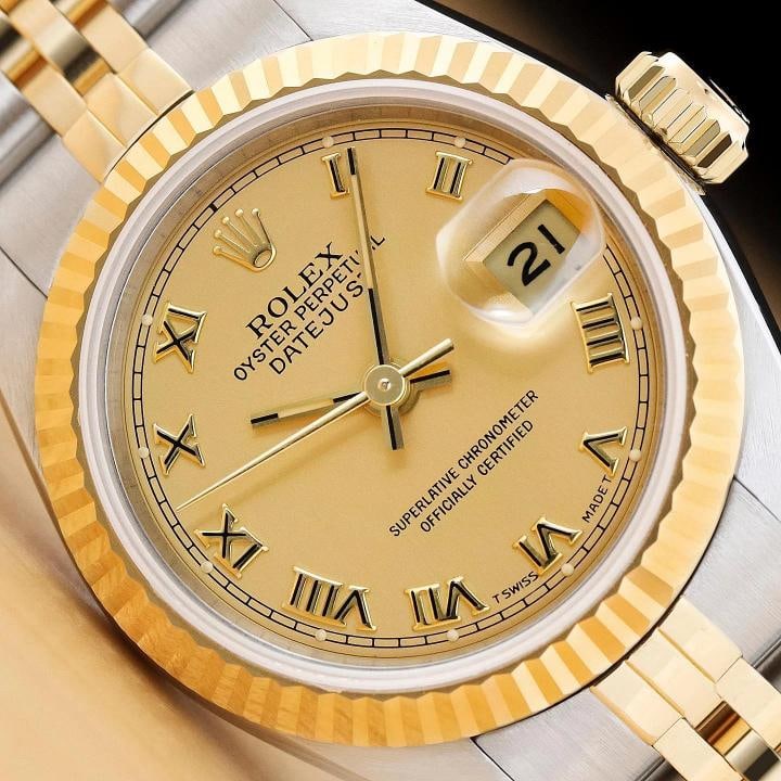 ROLEX LADIES DATEJUST 69173 CHAMPAGNE ROMAN DIAL 18K YELLOW GOLD STEEL WATCH: Condition: Pre-owned - Excellent,Bezel Color: Gold,Max Wrist Size: 6.26-6.75 in,Number of Jewels: 29 Jewels,Indices: Roman Numerals, 12-Hour Dial,Band: Rolex Two Tone Jubilee Bracelet,Bezel: Rolex