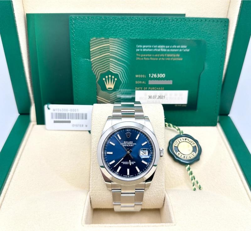 Rolex Datejust 41 126300 Blue Dial Stainless Steel Box Paper 2021: Style Number: 126300 Year: 2021 Model: Rolex Datejust 41 Case Material: Stainless Steel Band: Stainless Steel Bezel: Stainless Steel Dial: Blue Crystal: Sapphire Case Size: 41mm Includes: - Rolex Box 