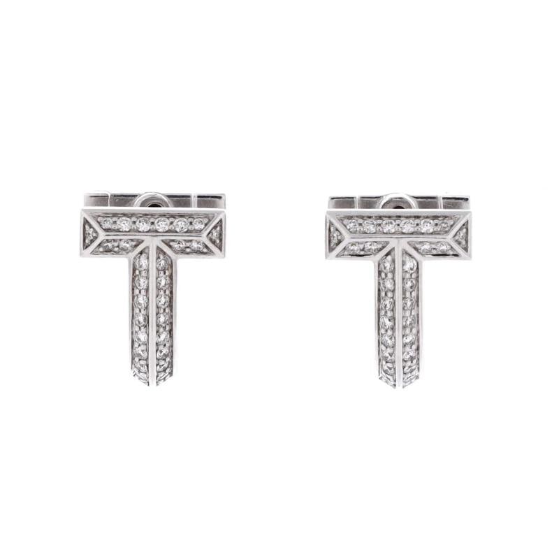 Tiffany & Co. T1 Huggie Hoop Earrings 18K White Gold with Half Pave Diamonds: Measurements: Height/Length: 12.20 mm, Width: 9.35 mm . Condition: Pre-owned - Good,Brand: Tiffany & Co.,Main Stone: Diamond,Metal: 18K White Gold,Metal Purity: 18K,Style: Hoop,Type: Earrings,Color: