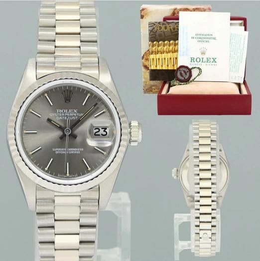 PAPERS Ladies Rolex DateJust Silver Sigma President 26mm 6917 White Gold Watch: Case & Dial Case Material: Rolex White Gold Case Size: 26mm Bezel: Rolex Silver Sigma Crystal: Rolex Sapphire Dial: Rolex Champagne Movement & Bracelet Movement: Rolex Automatic Bracelet Design: