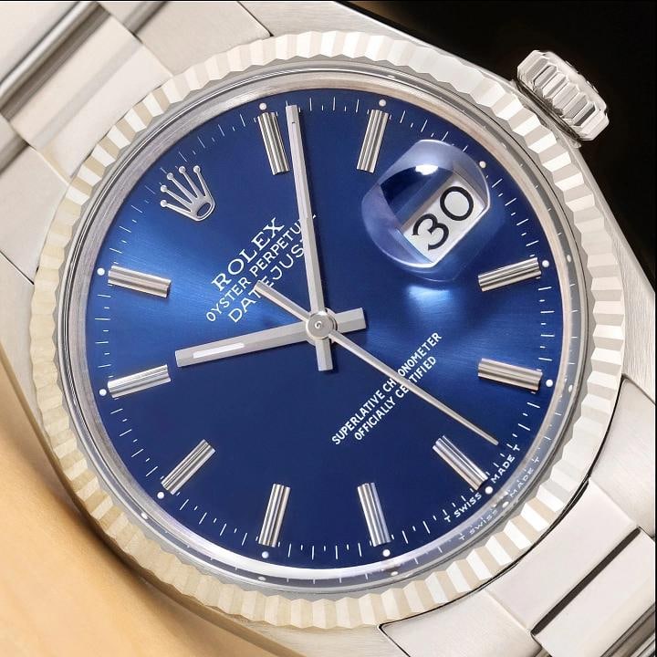 ROLEX MENS DATEJUST 16014 BLUE DIAL 18K WHITE GOLD BEZEL STAINLESS STEEL WATCH: Condition: Pre-owned - Excellent,Bezel Color: Silver,Max Wrist Size: 7.26-7.5 in,Number of Jewels: 27 Jewels,Indices: Stick Indexes, 12-Hour Dial, Multiple Hands,Bezel: Rolex 18K White Gold Fluted