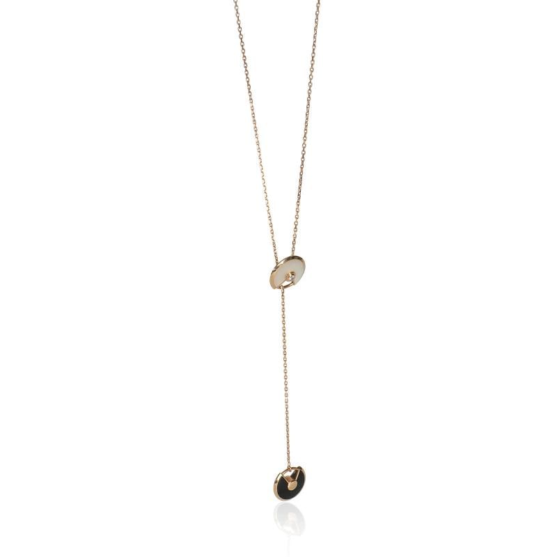 Cartier Rose Gold Mother Of Pearl and Onyx Amulette de Cartier Lariat Necklace: Condition: Pre-owned - Good,Necklace Length: 22 in,Country of Origin: France,Clasp/Buckle Type: Lobster Claw,Side Stone Type: Onyx,Main Stone: Mother Of Pearl,Metal Purity: 18k,With Original Box/Packa
