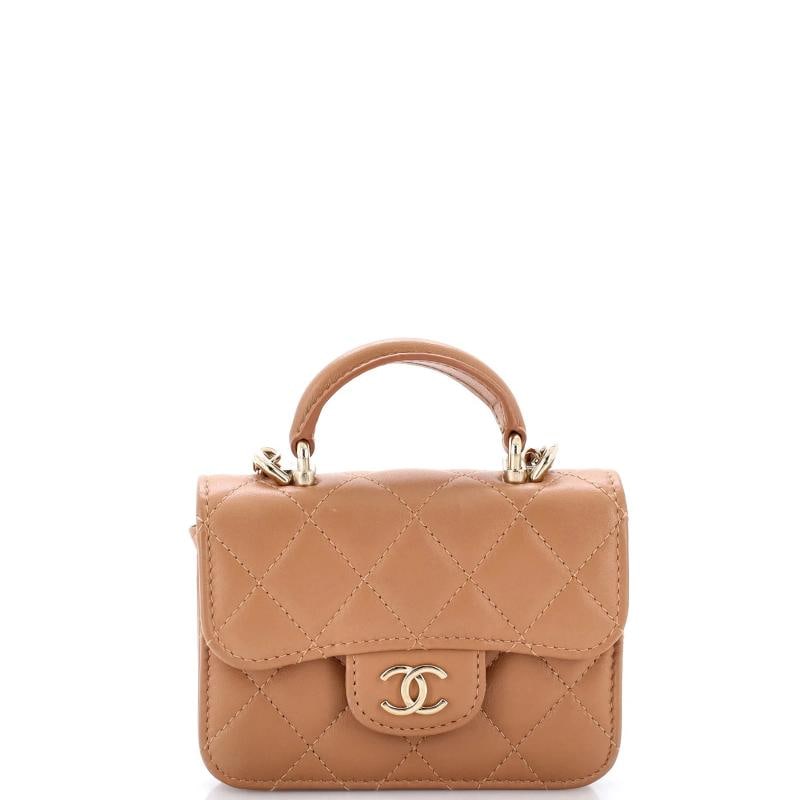 Chanel Top Handle Flap Coin Purse with Chain Quilted Lambskin: Measurements: Handle Drop 1.5", Height 3.5", Width 5", Depth 1.5", Strap Drop 21.5" . Condition: Pre-owned - Excellent,Brand: Chanel,Exterior Material: Leather,Style: Cross Body Bags,Exterior Color: N